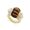 This beautiful ring combines the striking appearence of tigerseye and the brilliant radiance of diamonds. Set in a beautifully crafted 18k gold band.