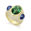 Rich 18k gold, diamonds, green tourmaline and blue sapphire gemstones form this intricate statement ring. LAGOS diamonds are the highest quality natural stones.