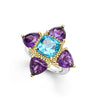 Caviar beaded 18k gold and smooth sterling silver are complimented with a pop of color from amethyst and swiss blue topaz gemstones to form this floral motif ring.