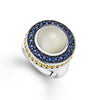 Moonstone and blue sapphire gemstones are set in Caviar beaded 18k gold and smooth sterling silver to form this statement ring.