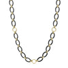 A 36 inch long necklace with 18K gold and black ceramic round, oval and beaded links.