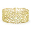 Smooth 18K gold circles form this dramatic cuff bracelet.