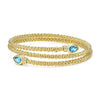 Two pear-shaped swiss blue topaz gemstones are accented by diamonds and set in 18k gold Caviar beading to form this luxe wrap bracelet. LAGOS diamonds are the highest quality natural stones.