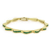 18K gold and emeralds form this luxe link wave bracelet.