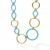 A 36 inch long necklace with 18K gold and blue ceramic round, oval and beaded links.